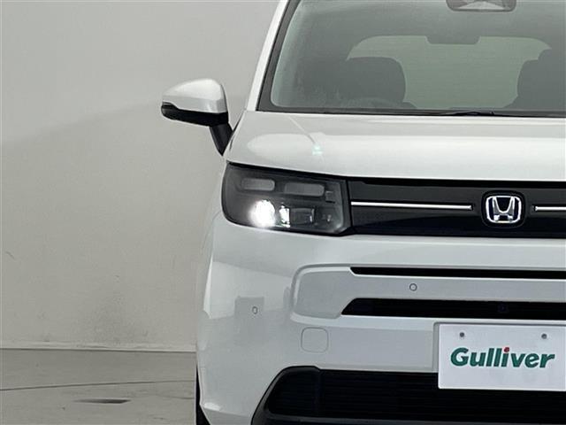 フリード ｅ：ＨＥＶエアー　ＥＸ　禁煙車／純正９型ナビ／両側パワースライドドア／全方位カメラ／追従クルーズコントロール／レーンキープアシスト／ハーフレザーシート／シートヒーター／ブラインドスポットインフォメーション／クリアランスソナー（27枚目）