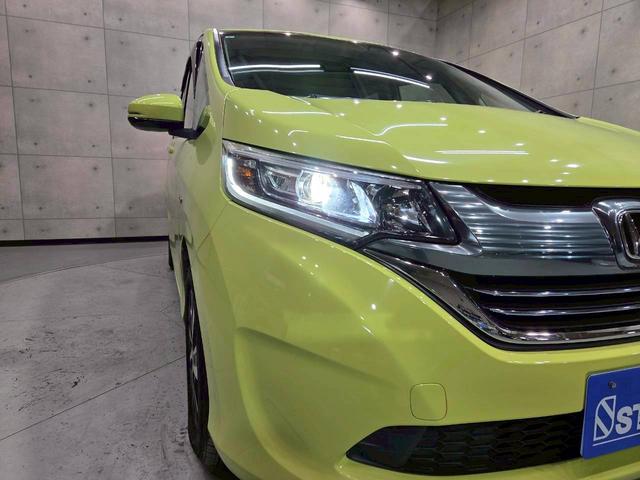 フリードハイブリッド ハイブリッド・ＥＸ　純正ナビ　フルセグＴＶ　Ｂｌｕｅｔｏｏｔｈ　バックカメラ　フリップダウン　ＬＥＤヘッドライト　両側パワスラ　純正１５インチＡＷ　ハーフレザーシート　シートヒーター　レーダークルーズ　スペアキー　ＥＴＣ（10枚目）