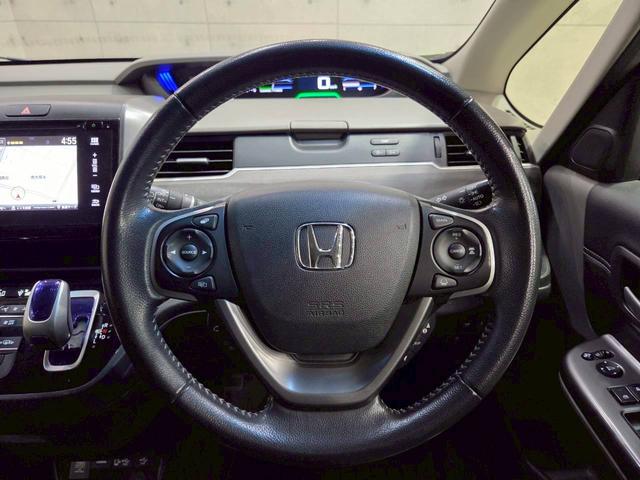 フリードハイブリッド ハイブリッド・ＥＸ　純正ナビ　フルセグＴＶ　Ｂｌｕｅｔｏｏｔｈ　バックカメラ　フリップダウン　ＬＥＤヘッドライト　両側パワスラ　純正１５インチＡＷ　ハーフレザーシート　シートヒーター　レーダークルーズ　スペアキー　ＥＴＣ（29枚目）