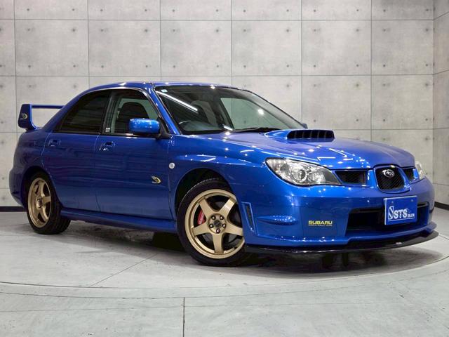 インプレッサ ＷＲＸ　ＷＲ－リミテッド　２００５　屋内車庫・カバー保管／ユーザー様直接仕入れ／ＳＴｉゲノムターボ計／ＳＴｉゲノムマフラー／ＳＴｉフロントリップ／スバル純正ＲＡＹＳ１７インチＡＷ／リアウイング／ＨＩＤヘッドライト／社外ナビ／リモコンキー（12枚目）
