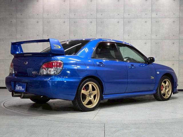 インプレッサ ＷＲＸ　ＷＲ－リミテッド　２００５　屋内車庫・カバー保管／ユーザー様直接仕入れ／ＳＴｉゲノムターボ計／ＳＴｉゲノムマフラー／ＳＴｉフロントリップ／スバル純正ＲＡＹＳ１７インチＡＷ／リアウイング／ＨＩＤヘッドライト／社外ナビ／リモコンキー（14枚目）