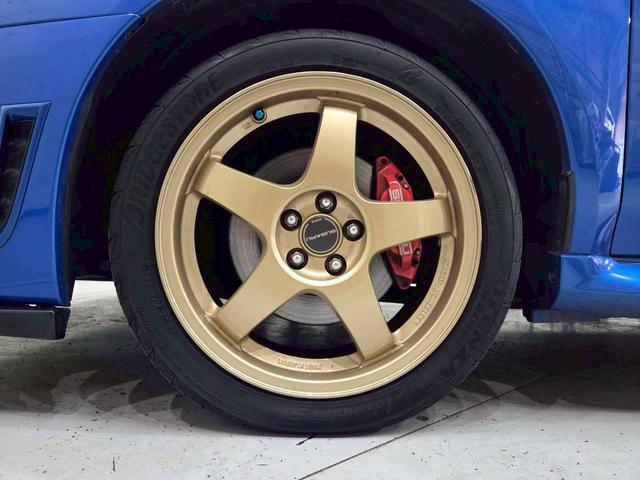 インプレッサ ＷＲＸ　ＷＲ－リミテッド　２００５　屋内車庫・カバー保管／ユーザー様直接仕入れ／ＳＴｉゲノムターボ計／ＳＴｉゲノムマフラー／ＳＴｉフロントリップ／スバル純正ＲＡＹＳ１７インチＡＷ／リアウイング／ＨＩＤヘッドライト／社外ナビ／リモコンキー（63枚目）