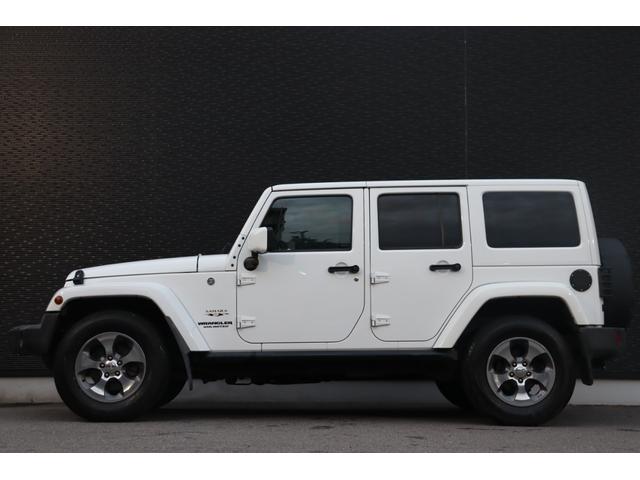 ジープ・ラングラーアンリミテッド サハラ　当店買取車両　社外グリル　Ｓステップ　ＡＬＰＩＮＥサウンド　クルコン　社外ナビ　地デジ　ＢＴ　Ｂカメラ　Ｓカメラ　茶本革　シートＨ　社外ＬＥＤライト　Ａライト　Ｆ／Ｒフォグ　純正１８インチＡＷ　ＥＴＣ（21枚目）