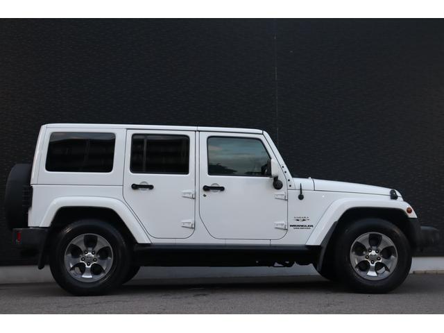 ジープ・ラングラーアンリミテッド サハラ　当店買取車両　社外グリル　Ｓステップ　ＡＬＰＩＮＥサウンド　クルコン　社外ナビ　地デジ　ＢＴ　Ｂカメラ　Ｓカメラ　茶本革　シートＨ　社外ＬＥＤライト　Ａライト　Ｆ／Ｒフォグ　純正１８インチＡＷ　ＥＴＣ（22枚目）