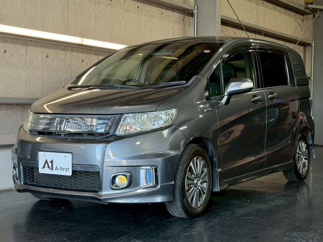 フリードスパイクハイブリッド ジャストセレクション 純正ナビ 両側電動スライドドア バックカメラ ETC オートエアコン HIDヘッドライト オートライト TV 電動格納ミラー クルーズコントロール 純正15インチアルミホイール 横滑り防止装置(7枚目)