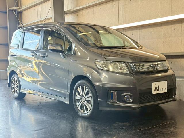 フリードスパイクハイブリッド ジャストセレクション 純正ナビ 両側電動スライドドア バックカメラ ETC オートエアコン HIDヘッドライト オートライト TV 電動格納ミラー クルーズコントロール 純正15インチアルミホイール 横滑り防止装置(9枚目)