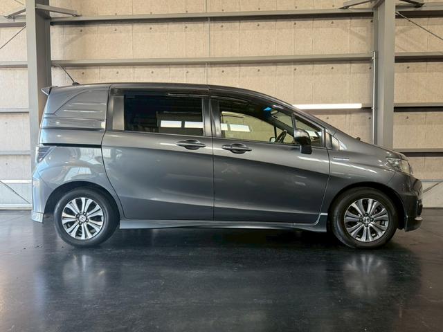 フリードスパイクハイブリッド ジャストセレクション 純正ナビ 両側電動スライドドア バックカメラ ETC オートエアコン HIDヘッドライト オートライト TV 電動格納ミラー クルーズコントロール 純正15インチアルミホイール 横滑り防止装置(10枚目)