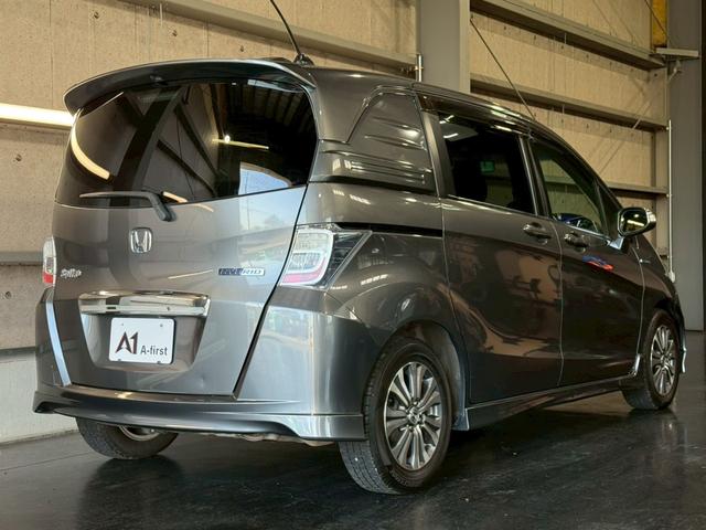 フリードスパイクハイブリッド ジャストセレクション 純正ナビ 両側電動スライドドア バックカメラ ETC オートエアコン HIDヘッドライト オートライト TV 電動格納ミラー クルーズコントロール 純正15インチアルミホイール 横滑り防止装置(11枚目)