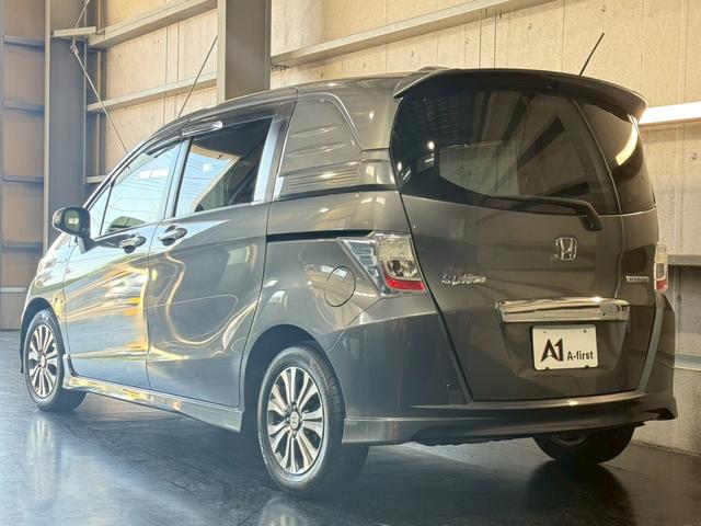 フリードスパイクハイブリッド ジャストセレクション 純正ナビ 両側電動スライドドア バックカメラ ETC オートエアコン HIDヘッドライト オートライト TV 電動格納ミラー クルーズコントロール 純正15インチアルミホイール 横滑り防止装置(13枚目)