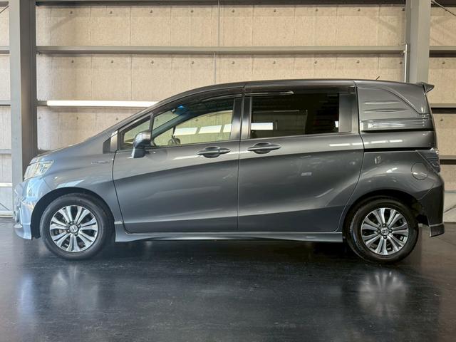 フリードスパイクハイブリッド ジャストセレクション 純正ナビ 両側電動スライドドア バックカメラ ETC オートエアコン HIDヘッドライト オートライト TV 電動格納ミラー クルーズコントロール 純正15インチアルミホイール 横滑り防止装置(14枚目)