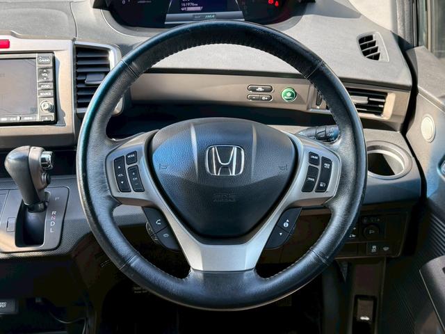 フリードスパイクハイブリッド ジャストセレクション 純正ナビ 両側電動スライドドア バックカメラ ETC オートエアコン HIDヘッドライト オートライト TV 電動格納ミラー クルーズコントロール 純正15インチアルミホイール 横滑り防止装置(25枚目)