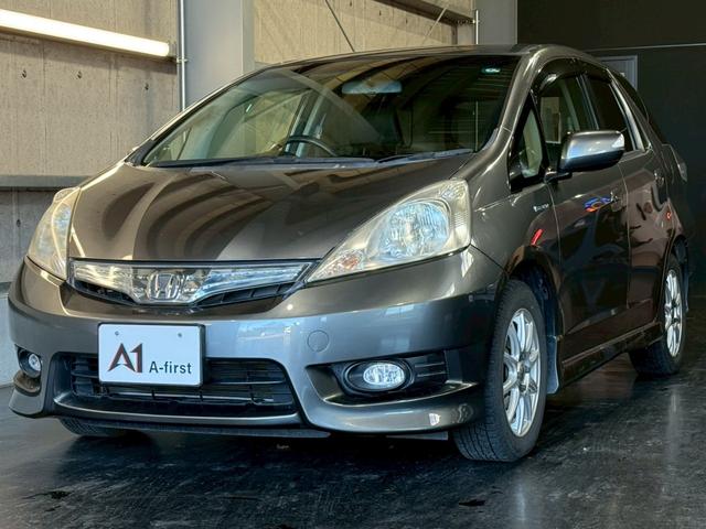 フィットシャトルハイブリッド ハイブリッド・スマートセレクション　純正ナビ　バックカメラ　ＥＴＣ　ハーフレザーシート　クルーズコントロール　フルセグＴＶ　Ｂｌｕｅｔｏｏｔｈ　スマートキー　電動格納ミラー　オートライト　フロントフォグランプ　１５インチアルミ（7枚目）