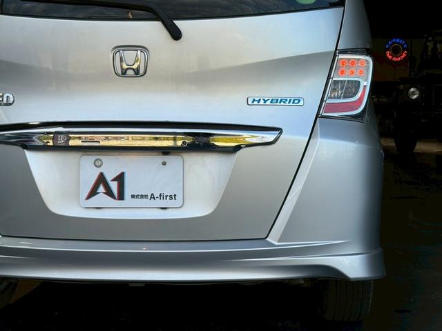 フリードハイブリッド ジャストセレクション　６人乗り　カロッツェリアナビ　電動スライドドア　バックカメラ　ＴＶ　Ｂｌｕｅｔｏｏｔｈ　ドライブレコーダー　クルーズコントロール　ＥＴＣ　スマートキー　オートライト　電動格納ミラー　オートエアコン（5枚目）