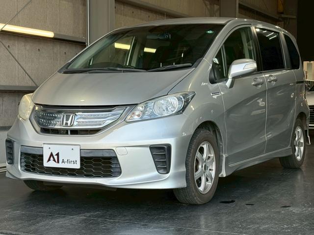 フリードハイブリッド ジャストセレクション　６人乗り　カロッツェリアナビ　電動スライドドア　バックカメラ　ＴＶ　Ｂｌｕｅｔｏｏｔｈ　ドライブレコーダー　クルーズコントロール　ＥＴＣ　スマートキー　オートライト　電動格納ミラー　オートエアコン（6枚目）