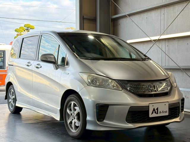 フリードハイブリッド ジャストセレクション　６人乗り　カロッツェリアナビ　電動スライドドア　バックカメラ　ＴＶ　Ｂｌｕｅｔｏｏｔｈ　ドライブレコーダー　クルーズコントロール　ＥＴＣ　スマートキー　オートライト　電動格納ミラー　オートエアコン（8枚目）