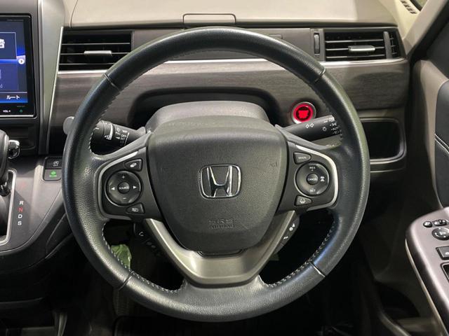 フリード Ｇ・ホンダセンシング　両側電動ドア　純正９インチナビ　バックカメラ　寒冷地仕様　ホンダセンシング　レーダークルーズ　禁煙車　ハーフレザーシート　ドラレコ　スマートキー　ＬＥＤヘッド　ビルトインＥＴＣ　純正１５インチアルミ（22枚目）