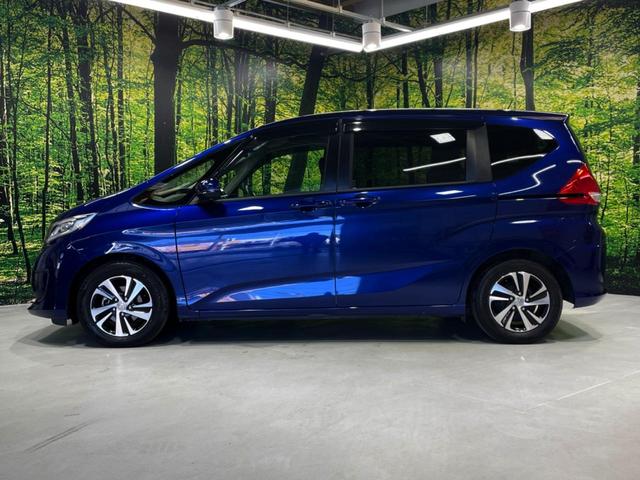 フリード Ｇ・ホンダセンシング　両側電動ドア　純正９インチナビ　バックカメラ　寒冷地仕様　ホンダセンシング　レーダークルーズ　禁煙車　ハーフレザーシート　ドラレコ　スマートキー　ＬＥＤヘッド　ビルトインＥＴＣ　純正１５インチアルミ（32枚目）