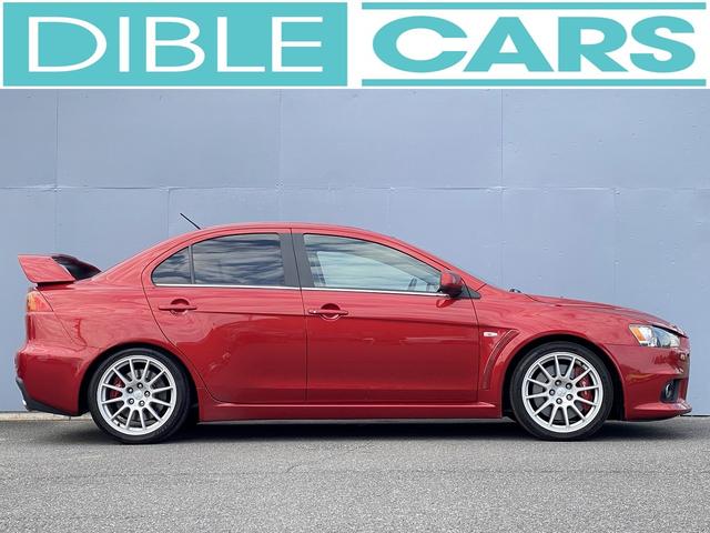 ランサー ＧＳＲエボリューションＸ　１年保証付　修復歴無し　ワンオーナー　禁煙車　走行距離６０，５００ｋｍ　５ＭＴ　ＨＫＳ車高調　ＲＥＣＡＲＯシート　大型リヤスポイラー　ナビＴＶ　革巻きステアリング　純正１８ＡＷ　キーレス　ＨＩＤライト（8枚目）