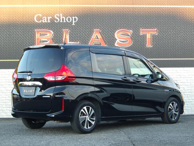 フリードハイブリッド ハイブリッド・ＥＸ　ハーフレザー　フリップダウンモニター　純正メモリナビ　バックカメラ　シートヒーター　両側パワースライドドア　前後ドラレコ　ビルトインＥＴＣ　オートライト　純正１５ＡＷ　ＬＥＤヘッドライト　スマートキー（4枚目）