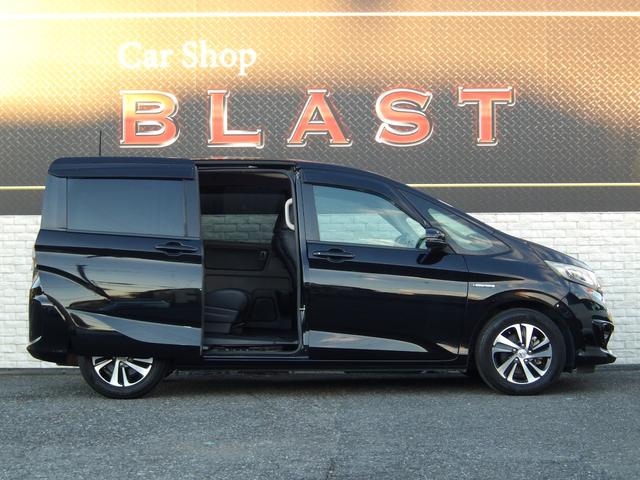 フリードハイブリッド ハイブリッド・ＥＸ　ハーフレザー　フリップダウンモニター　純正メモリナビ　バックカメラ　シートヒーター　両側パワースライドドア　前後ドラレコ　ビルトインＥＴＣ　オートライト　純正１５ＡＷ　ＬＥＤヘッドライト　スマートキー（9枚目）