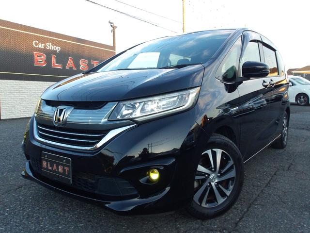 フリードハイブリッド ハイブリッド・ＥＸ　ハーフレザー　フリップダウンモニター　純正メモリナビ　バックカメラ　シートヒーター　両側パワースライドドア　前後ドラレコ　ビルトインＥＴＣ　オートライト　純正１５ＡＷ　ＬＥＤヘッドライト　スマートキー（10枚目）