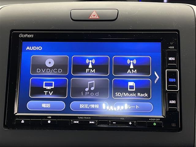 フリードハイブリッド ハイブリッド・クロスターホンダセンシング　４ＷＤ　社外ＳＤナビ　Ｂｌｕｅｔｏｏｔｈ　ＣＤ　ＤＶＤ　フルセグ　バックカメラ　ビルトインＥＴＣ　クルーズコントロール　車線逸脱警報　後方コーナーセンサー　両側パワースライドドア　純正ＡＷ　サンシェー（3枚目）