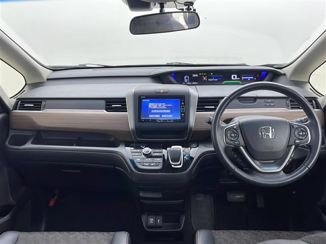 フリードハイブリッド ハイブリッド・クロスターホンダセンシング　４ＷＤ　社外ＳＤナビ　Ｂｌｕｅｔｏｏｔｈ　ＣＤ　ＤＶＤ　フルセグ　バックカメラ　ビルトインＥＴＣ　クルーズコントロール　車線逸脱警報　後方コーナーセンサー　両側パワースライドドア　純正ＡＷ　サンシェー（42枚目）