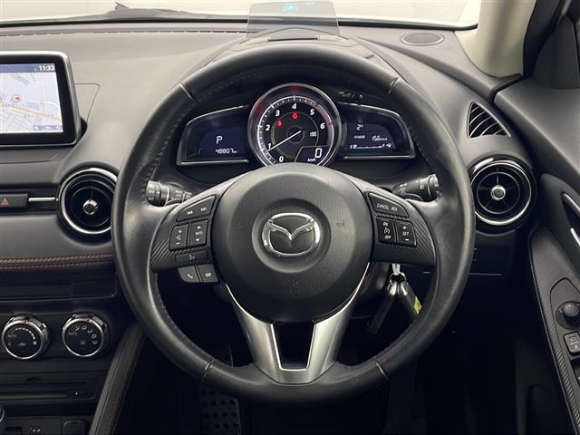 デミオ ＸＤツーリング　禁煙車　衝突被害軽減ブレーキ　純正ＳＤナビ　バックカメラ　クルーズコントロール　ＨＩＤオートライト　社外１５インチアルミホイール　ブラインドスポットモニター　パドルシフト　スマートキー　ＥＴＣ（7枚目）