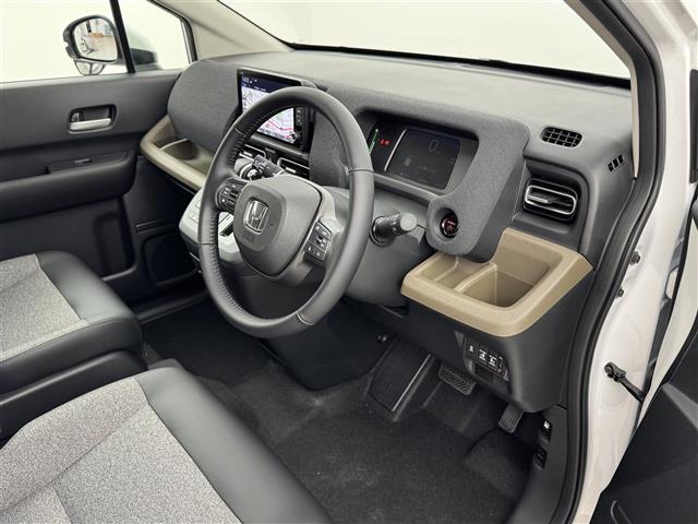 フリード ｅ：ＨＥＶエアー　ＥＸ　登録済未使用車　純正９型ナビ　バックカメラ　ホンダセンシング　レーダークルコン　衝突軽減ブレーキ　レーンキープ　アクセル踏み間違い防止　ＢＳＭ　両側電動スライドドア　シートヒーター　純正１５インチＡＷ（23枚目）