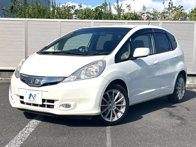 フィットハイブリッド スマートセレクション 禁煙車 ナビ ETC フルセグ Bluetooth スマートキー HIDヘッドライト LEDフォグライト クルーズコントロール 革巻きステアリング オートエアコン CD/DVD再生 オートライト(21枚目)