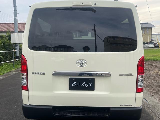 ハイエースバン ロングスーパーGL 車中泊 ビッグXナビ Bluetooth フリップダウンモニター 全方位モニター ウッド調ステアリング ウッド調インパネ 茶レザーシート ベッドキッド デジタルインナーミラー(9枚目)