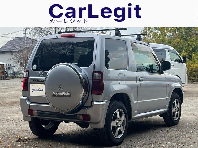 パジェロミニ アクティブフィールドエディション　距離５万キロ台　４ＷＤ　ワンオーナー　禁煙　ナビ　ＥＴＣ　　純正アルミ　ルーフキャリア　電動格納ミラー　エアコン（5枚目）
