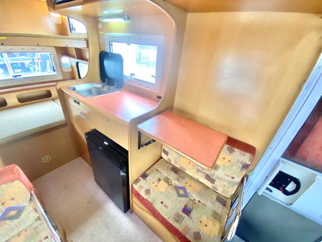 カムロード  バンテック コルドバンクス ディーゼル 8名乗車 タイベル交換済 FFヒータ- 新品冷蔵庫 ランチョ製前後ショック リアクーラー サイドオーニング 1500Wインバーター 電子レンジ テレビ(49枚目)