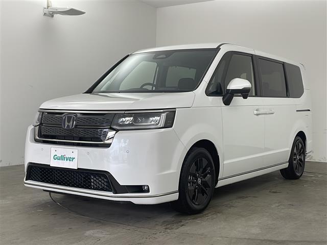ステップワゴン ｅ：ＨＥＶスパーダ　・登録済未使用車・純正１１．４インチナビ（ＣＤ／ＤＶＤ／ＴＶ／ＢＴ／ＳＤ）・純正１５．６インチフリップダウンモニター・両側パワースライドドア・衝突軽減ブレーキ（ＣＭＢＳ）・先行車発進お知らせ（3枚目）