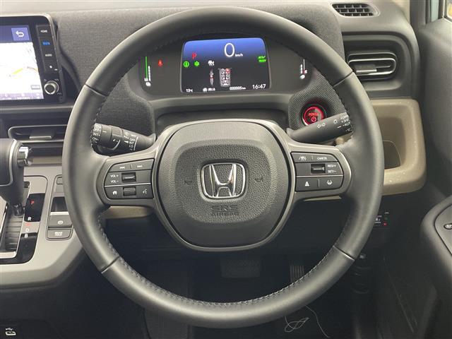 フリード ｅ：ＨＥＶエアー　ＥＸ　登録済未使用車　９型ナビ　ＴＶ　バックカメラ　衝突軽減ブレーキ　レーンキープアシストシステム　ブラインドスポットモニタ　両側パワースライドドア　ハーフレザー　シートヒーター　ＬＥＤ　オートハイビーム（21枚目）