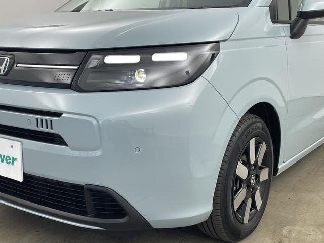 フリード ｅ：ＨＥＶエアー　ＥＸ　登録済未使用車　９型ナビ　ＴＶ　バックカメラ　衝突軽減ブレーキ　レーンキープアシストシステム　ブラインドスポットモニタ　両側パワースライドドア　ハーフレザー　シートヒーター　ＬＥＤ　オートハイビーム（45枚目）