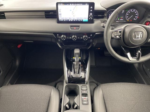 ヴェゼル ｅ：ＨＥＶ　Ｚ　・登録済未使用車・ホンダセンシング・衝突軽減ブレーキ・路外逸脱抑制機能・ＢＳＭ・アダプティブクルーズコントロール・踏み間違い防止・後退出庫サポート・純正ナビ・ＵＳＢ・置くだけ充電・ＥＴＣ・バックカメラ（19枚目）