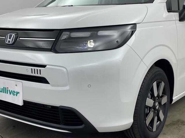 フリード ｅ：ＨＥＶエアー　ＥＸ　登録済未使用車　純正９インチナビ　ＴＶ　バックカメラ　レーダークルーズコントロール　衝突軽減ブレーキ　レーンキープアシスト　オートハイビーム　ブラインドスポットモニター　ハーフレザー　シートヒーター（38枚目）