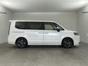 ステップワゴン ｅ：ＨＥＶスパーダ　・登録済未使用車・純正１１．４インチナビ（ＣＤ／ＤＶＤ／ＴＶ／ＢＴ／ＳＤ）・純正１５．６インチフリップダウンモニター・両側パワースライドドア・衝突軽減ブレーキ（ＣＭＢＳ）・先行車発進お知らせ（7枚目）