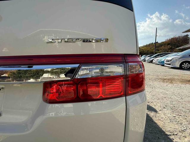 ステップワゴン Ｇ　Ｌ　ＨＤＤナビパッケージ　ＥＴＣ　バックカメラ　ナビ　両側スライド・片側電動　ＨＩＤ　キーレスエントリー　３列シート　ウォークスルー　ＡＴ　盗難防止システム　衝突安全ボディ　ＡＢＳ　エアコン　パワーステアリング（28枚目）