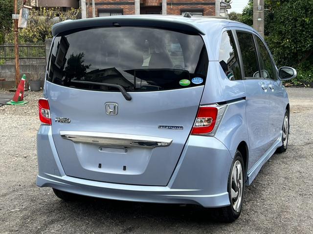 フリードハイブリッド ジャストセレクション　ＥＴＣ　バックカメラ　ナビ　ＴＶ　オートクルーズコントロール　両側電動スライドドア　オートライト　ＨＩＤ　スマートキー　アイドリングストップ　電動格納ミラー　後席モニター（17枚目）