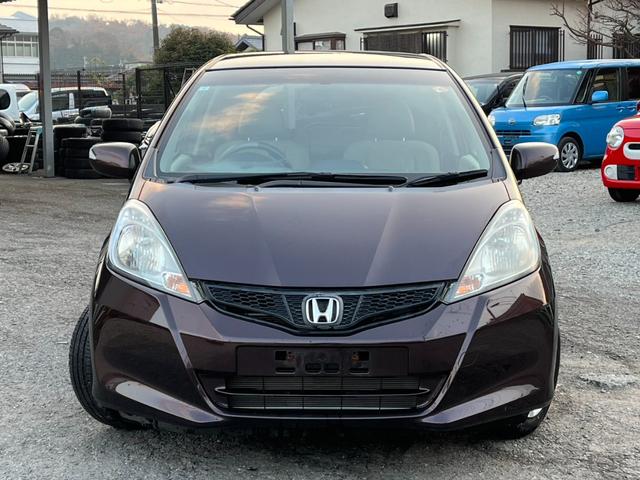 フィット 13G・スマートセレクション スマートキー CVT 盗難防止システム 衝突安全ボディ ABS CD ミュージックプレイヤー接続可 エアコン パワーステアリング パワーウィンドウ(12枚目)