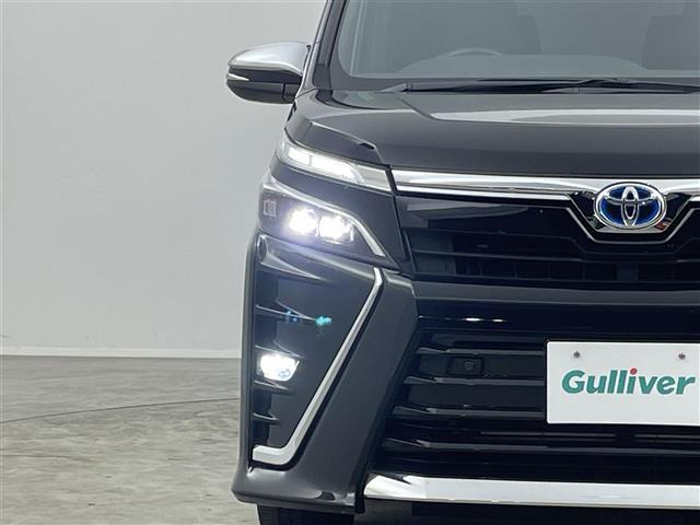 ヴォクシー ハイブリッドＺＳ　煌ＩＩＩ　純正１０インチナビ　フリップダウンモニター　バックカメラ　ビルトインＥＴＣ　セーフティセンス　クルーズコントロール　シートヒーター　純正アルミホイール　スマートキー　オートハイビーム　ＬＥＤライト（32枚目）