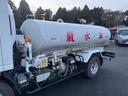 エルフトラック 散水車　ワイド　極東開発　ＬＨ０４－３０２Ｒ　前後散水　サブエンジン式　容量４０００Ｌ　吸入ホース　走行２７千ｋｍ　積載４ｔ　Ｆ６　６速　マニュアル　ＥＴＣ１．０（8枚目）