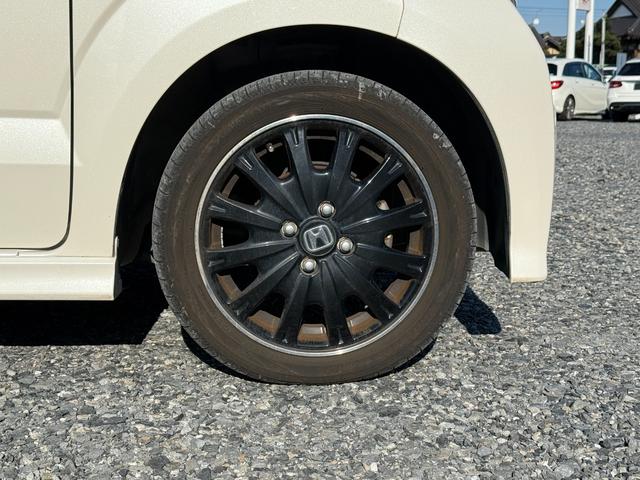 Ｎ－ＢＯＸカスタム ２トーンカラースタイル　Ｇ・ターボＬパッケージ　アルミ　キーレスエントリー　パワーステアリング　半革シート　ナビＴＶ　横滑り防止機能　パワーウィンドウ　ＬＥＤヘッドライト　電動格納ミラー　エアコン　スマートキー　ＡＢＳ　ＥＴＣ車載器　ＤＶＤ再生（13枚目）