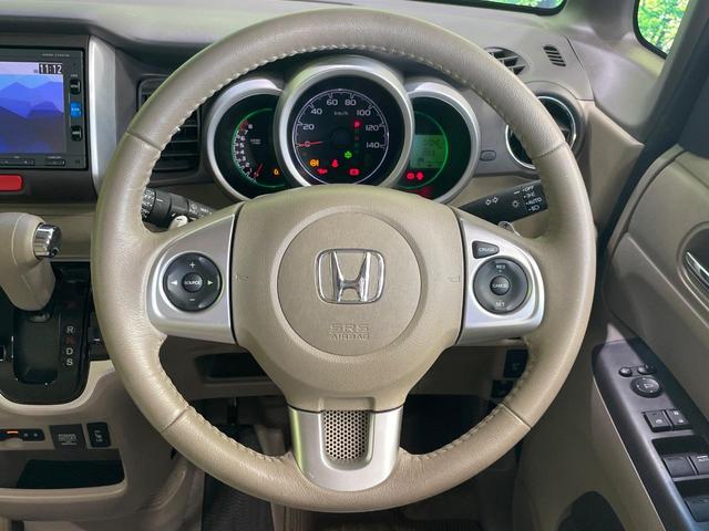 N-BOX G ターボSSパッケージ 純正ナビ バックカメラ 両側電動スライドドア 衝突軽減 HIDヘッド オートライト シートヒーター オートエアコン 革巻きハンドル プライバシーガラス シートバックテーブル ロールサンシェイド(11枚目)