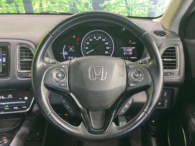 ヴェゼル ハイブリッドＺ・ホンダセンシング　純正ＳＤナビ　バックカメラ　衝突被害軽減システム　レーダークルーズ　禁煙車　ドラレコ　スマートキー　ＬＥＤヘッド　ビルトインＥＴＣ　車線逸脱警報　オートライト　デュアルエアコン　純正１７インチアルミ（11枚目）