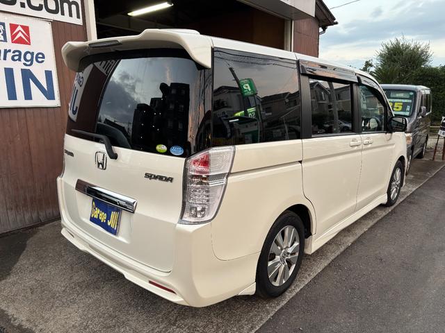 ステップワゴンスパーダ Ｚ　ワンオーナー　タイミングチェーン　ＨＤＤナビＴＶ　スマートキー　両側パワースライドドア　リアカメラ　ＨＩＤ　ＥＴＣ　ＤＶＤ　ＣＤ　ミュージックサーバー　リアモニター　ＡＷ　記録簿（6枚目）