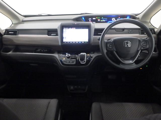 フリードハイブリッド ハイブリッド・Ｇホンダセンシング　／純正９インチナビ／１１．６インチ後席モニター／前後ドラレコ／シートヒータ／サイドカーテンＳＲＳ／ドアバイザー／ＬＥＤライト／アクティブコーナーリングライト／ワンオーナー／オートリトラミラー／ＨＤＭＩ（12枚目）