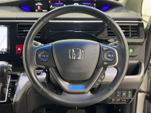 ステップワゴンスパーダ スパーダホンダセンシング　盗難防止　助手席エアバッグ　ワンオーナ－　Ｗパワスラ　記録簿有　地デジ　サイドエアバッグ　ＬＥＤライト　横滑り防止システム　オートエアコン　リアカメラ　ナビ＆ＴＶ　ＥＴＣ付（11枚目）